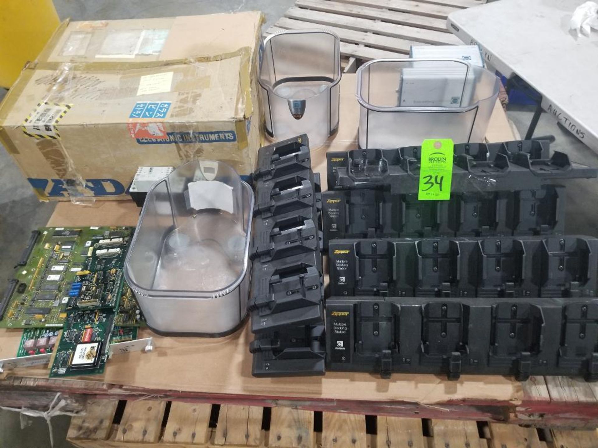Pallet of assorted chargers and electrical.