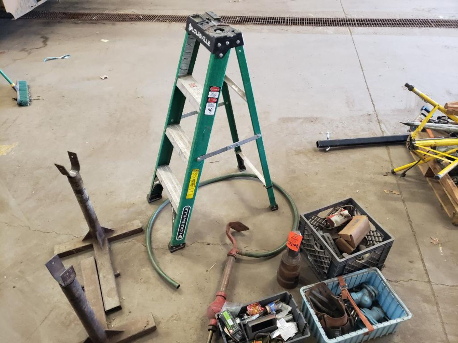 Ladder and assorted tools.