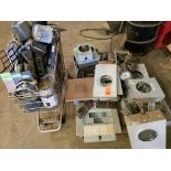 Large assortment of meters, bases, and electrical hardware.