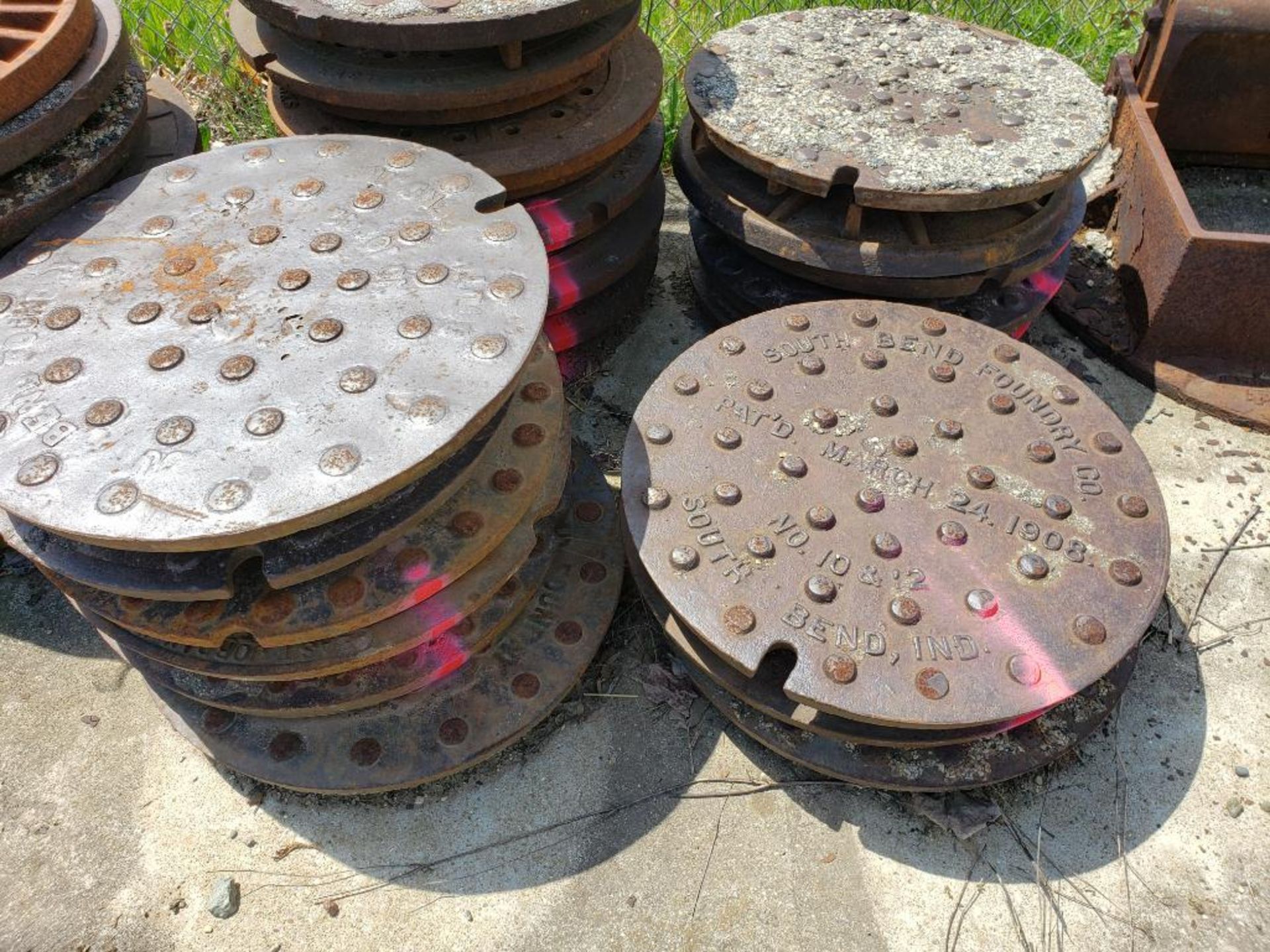 Assorted man hole covers. (units with pink marking are NOT included in lot) - Image 6 of 8