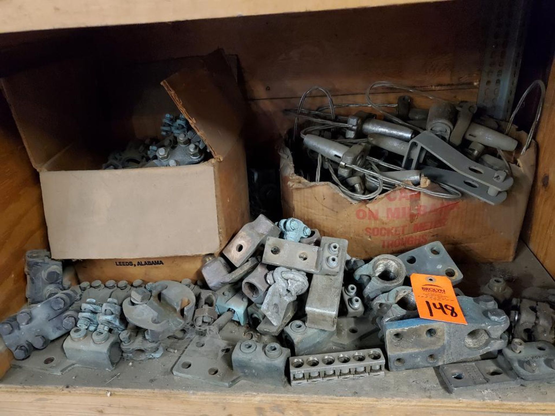 Contents of one shelf cubby - Large assortment of electrical lugs, fittings, and connectors.