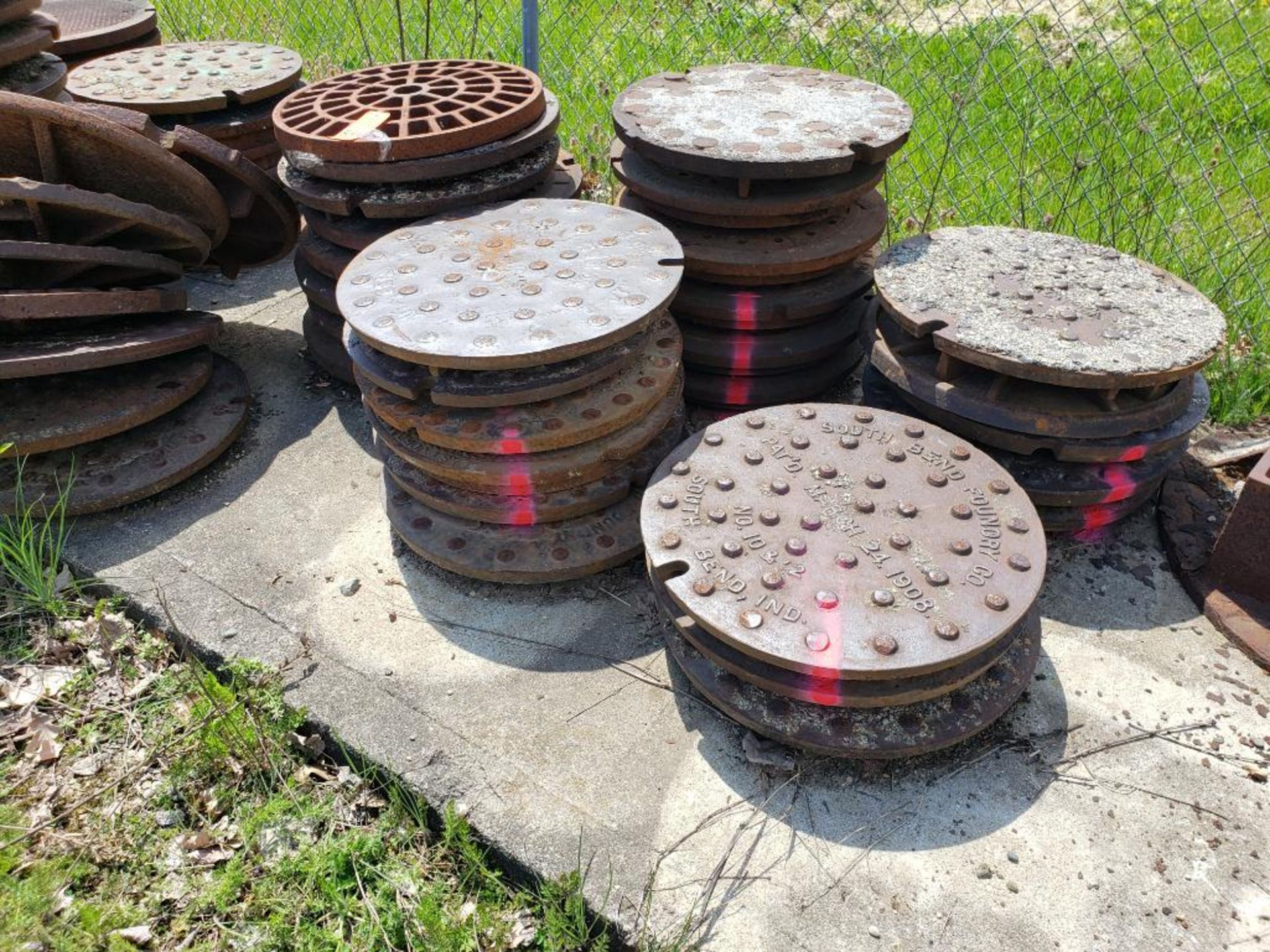 Assorted man hole covers. (units with pink marking are NOT included in lot) - Image 8 of 8