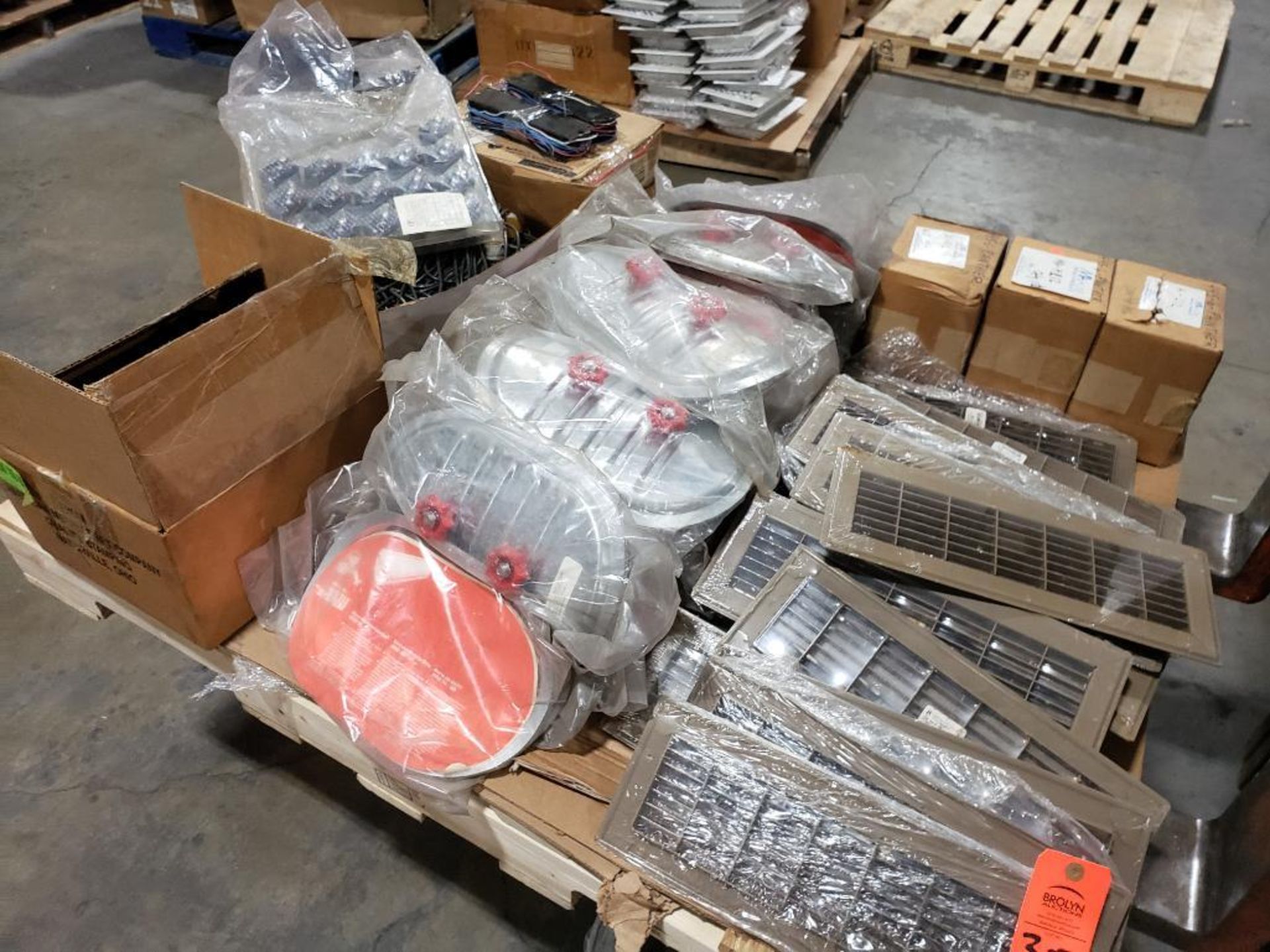 Pallet of assorted hardware and parts.
