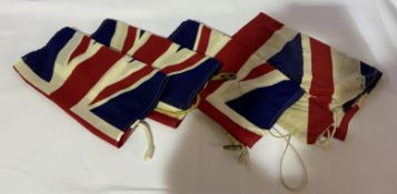 Four assorted Union Flags, three by repute are vintage Royal Navy Union Jacks from HMS Unicorn,