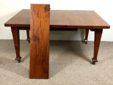 A mahogany veneered extending dining table, early 20th century, with one additional leaf, on