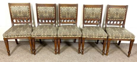 A set of ten late Victorian dining chairs, with padded seats and backs, moulded supports and