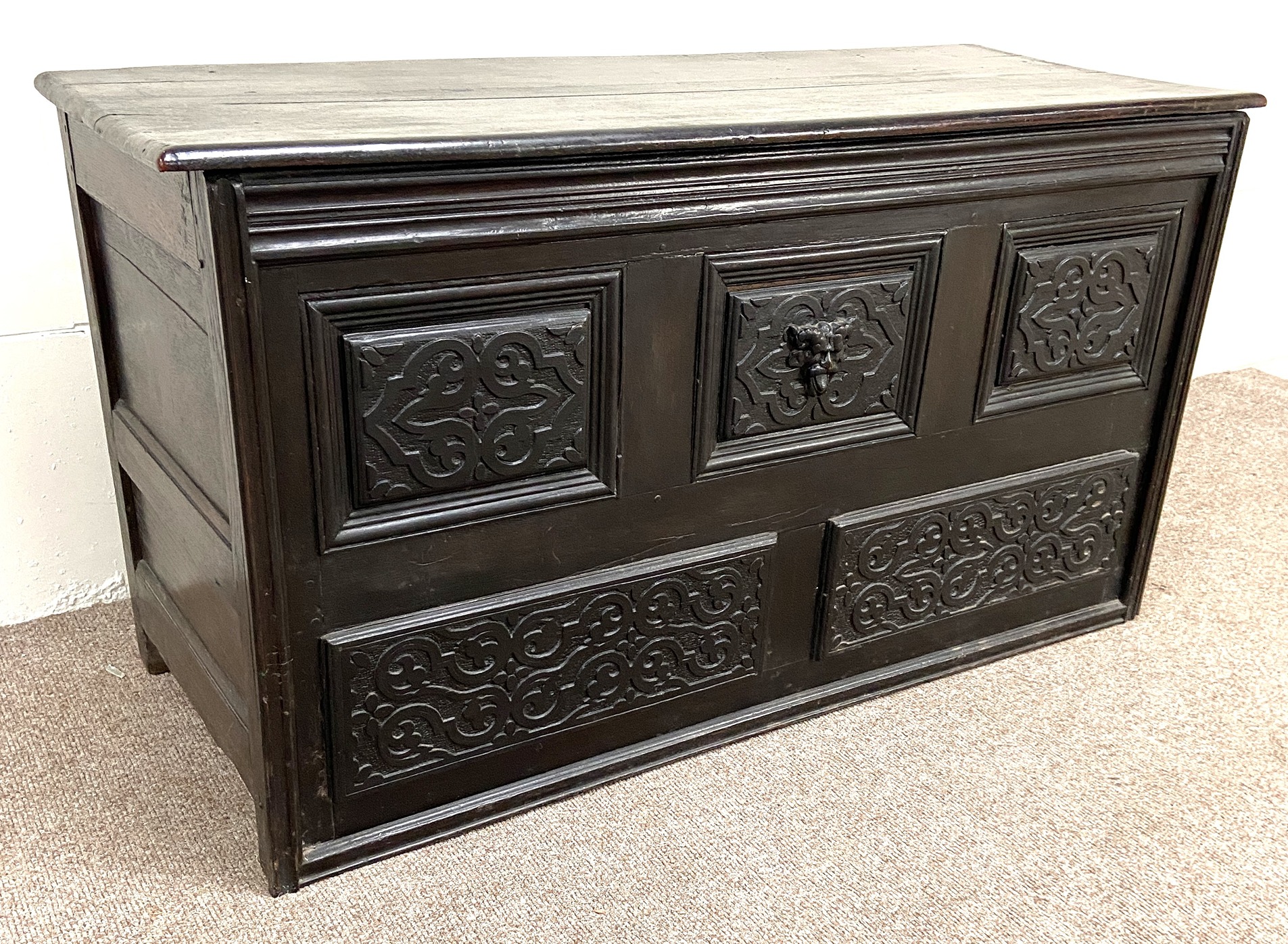 A Carolean oak coffer, 17th century and later, the front carved with moulded and divided panels, - Image 2 of 5