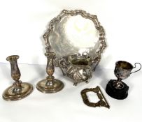 Assorted silver plate, including a salver, a pair of squat candlesticks, and a large sugar bowl etc.