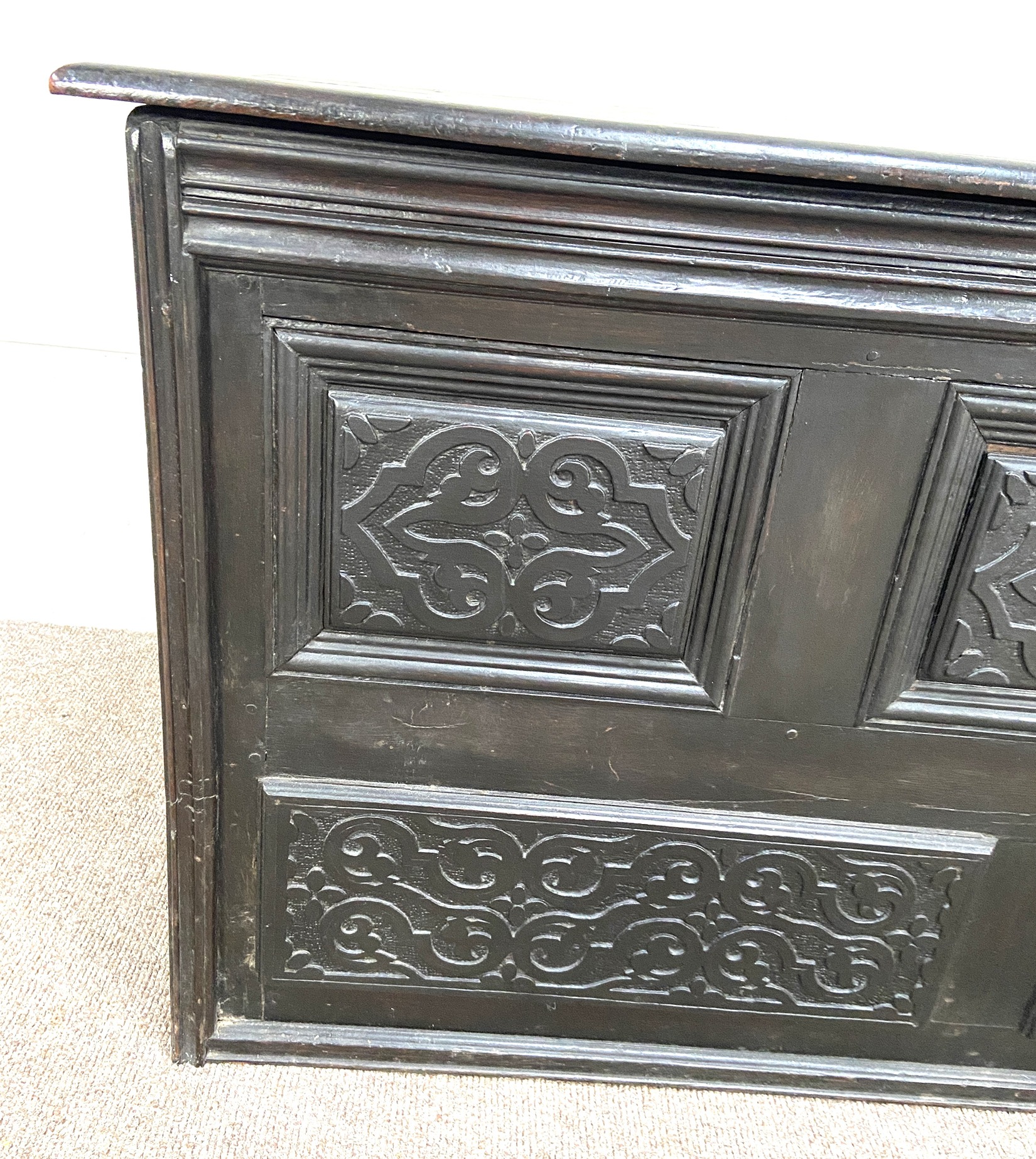 A Carolean oak coffer, 17th century and later, the front carved with moulded and divided panels, - Image 3 of 5