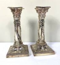 A pair of Edwardian silver squat Corinthian column candlesticks, hallmarked Sheffield, 1903,