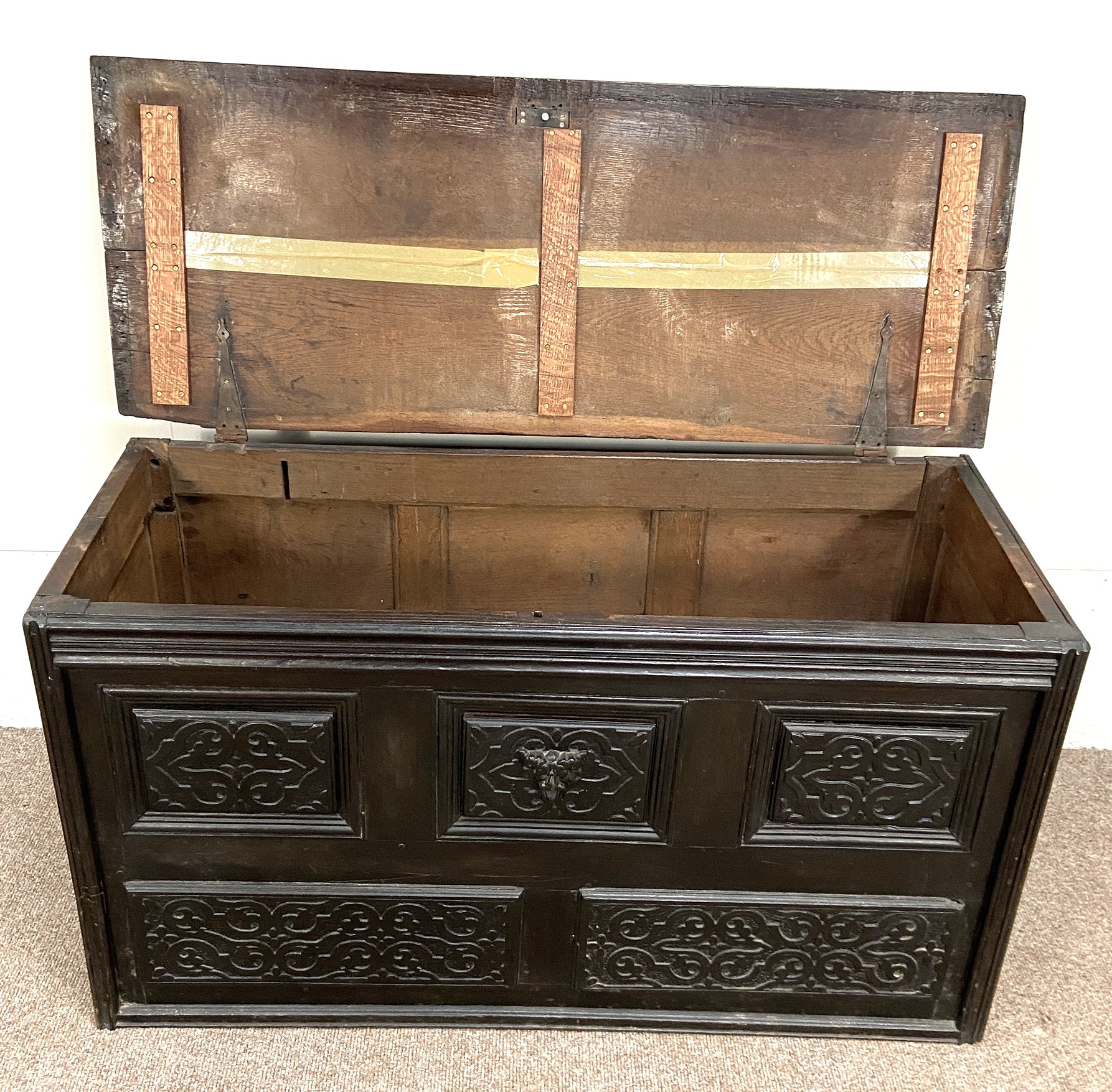 A Carolean oak coffer, 17th century and later, the front carved with moulded and divided panels, - Image 5 of 5