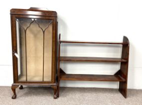 An early 20th century walnut veneered display cabinet; together with a three shelf wall unit (2)