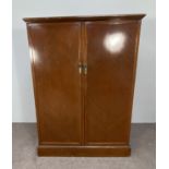 A Gentleman's compactum wardrobe, early 20th century, with two doors and interior fitted with