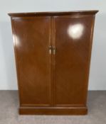 A Gentleman's compactum wardrobe, early 20th century, with two doors and interior fitted with