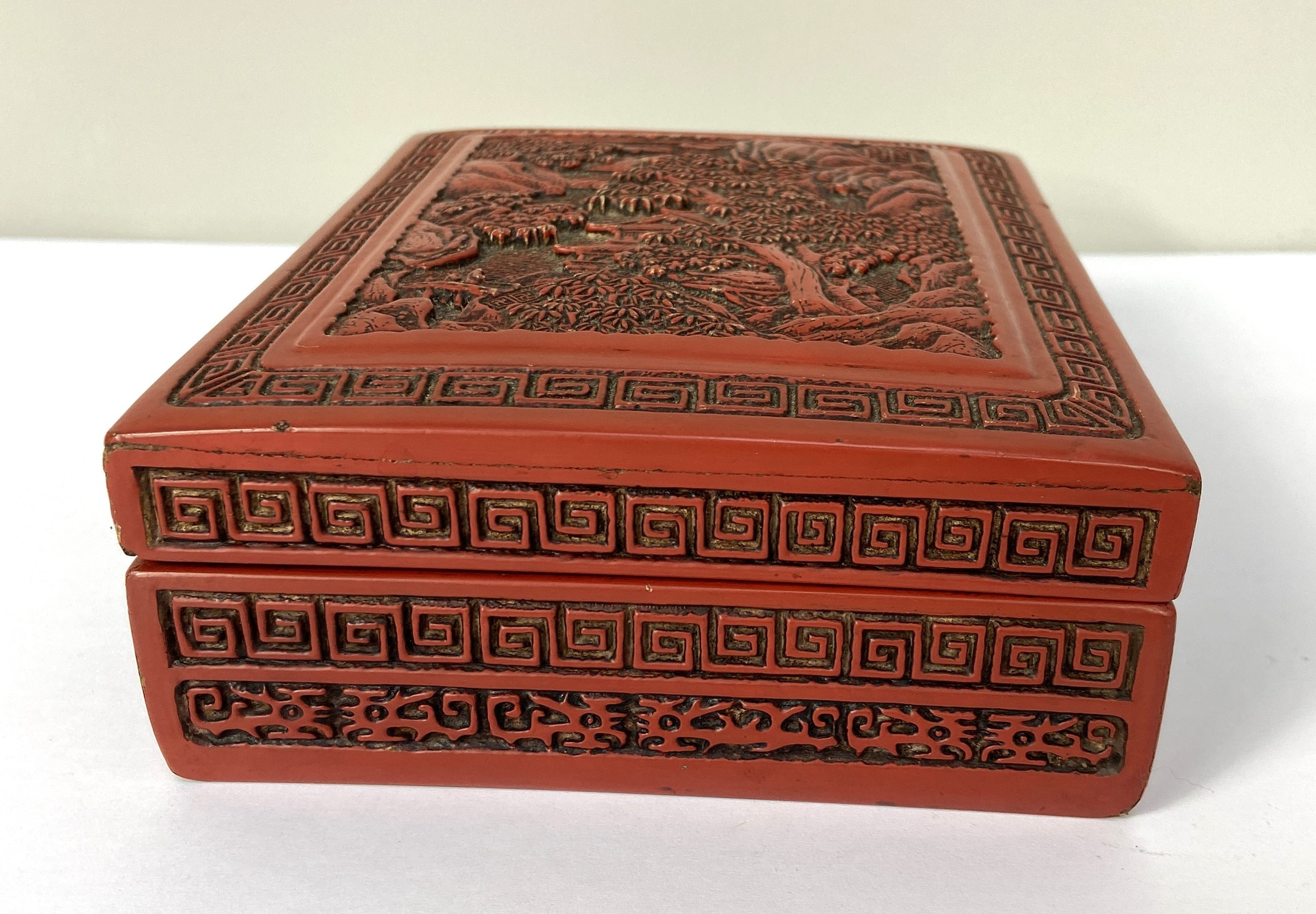A Chinese export Cinnabar lacquered trinket box, 20th century, the top decorated with a tree lined - Image 4 of 4