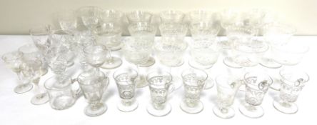 A selection of fine table glasses, including a set of etched glass champagne bowls, white wine