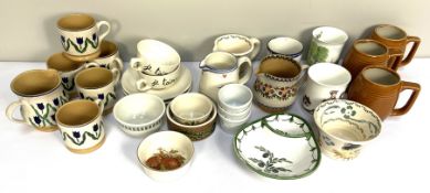 A selection of modern kitchen china ware, including three barrell shaped mugs, assorted small jugs