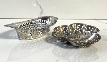 Two silver bon bon dishes, hallmarked Birmingham 1911, oval with pierced decoration; the other of