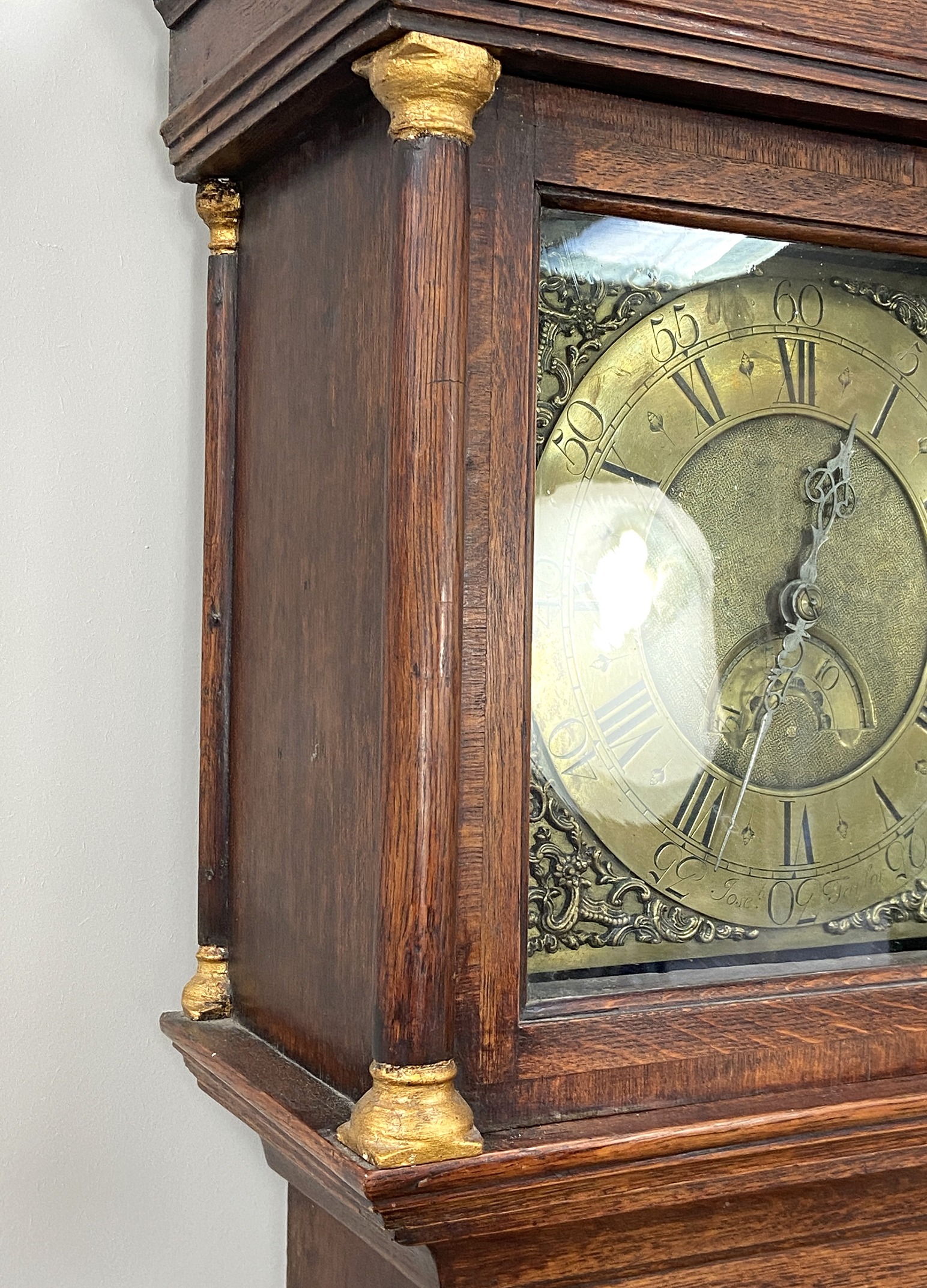 An early 18th century oak longcase clock, by Joseph Taylor, in an architectural provincial caddy - Image 6 of 8