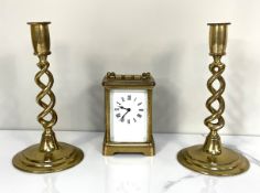 A vintage brass cased carriage clock, unsigned enamel dial; also two twist stem brass