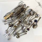 Assorted silver plated flatware and related, including two pairs of nut crackers, a button hook