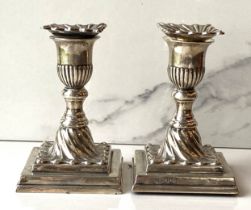 A pair of Victorian silver desk candlesticks, Sheffield 1894, with removeable drip pans, turned