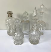 Five assorted decanters, including a silver collared ‘Dimple’ decanter, and four others (5)