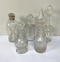 Five assorted decanters, including a silver collared ‘Dimple’ decanter, and four others (5)