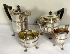 An Edwardian silver plated four piece tea service, including a hot water jug, teapot, sugar bowl and
