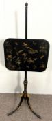 A Regency chinoiserie pole-screen, circa 1810, with rounded rectangular adjustable panel, on a