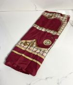 An equestrian inspired Hermès ladies silk scarf, decorated in claret and gold on a check