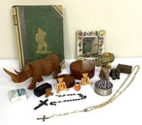 Assorted items, including a porcelain mirror with encrusted flowers, a carved rhino, a trinket