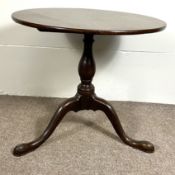 A George III provincial oak wine table, 18th century and later, with circular top and set on a