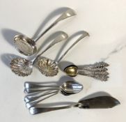 A group of assorted silver flatware, including three casting spoons with pierced bowls, a silver Old