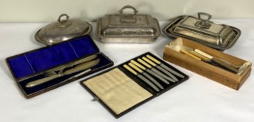 Three assorted silver plated covered entree dishes; a cased pair of fish servers and assorted