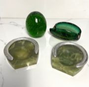 A very large green bubble glass dump or paperweight, of typical oval form; together with a