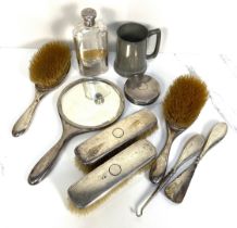 An Edwardian silver backed dressing table set, hallmarked London, circa 1918, with engine turned