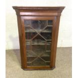 A George III style oak corner wall cabinet, with glazed door, dentil cornice and three shelves,