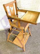 A vintage high chair, with folding top
