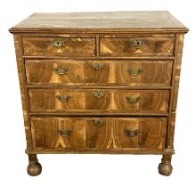 A Queen Anne figured walnut and possibly yew wood chest of drawers, early 18th century,  with a