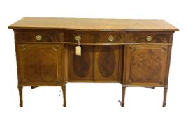 A Georgian style mahogany sideboard, with central bow drawer and niche with two cabinet doors,