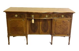 A Georgian style mahogany sideboard, with central bow drawer and niche with two cabinet doors,