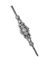 An Edwardian diamond bar brooch, early 20th century, set in white and yellow metal, set with old