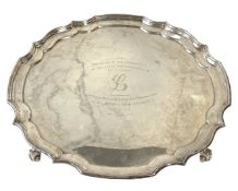 A silver presentation salver, hallmarked Birmingham, 1971, of typical circular lobed pie crust form,