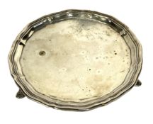 A silver salver, hallmarked Edinburgh 1937, Hamilton & Inches, of typical circular form, on three