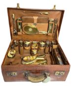 A Ladies Silver/Gilt and Crocodile Vanity Travel Case, enclosing a variety of silver gilt and 15