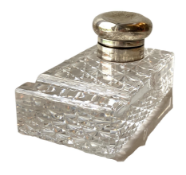 An Edwardian silver and cut glass desk inkwell, hallmarked London, date obscured, with a hinged well