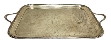 A large silver rectangular tea tray, hallmarked Sheffield 1936, of rounded oblong dished form with