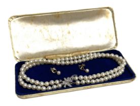 A fine double row cultured pearl and diamond necklet, 20th century,  with 100 Akoya cultured