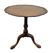 A George III mahogany wine table, circa 1780, with a wide cusped circular top, with snap top hinge
